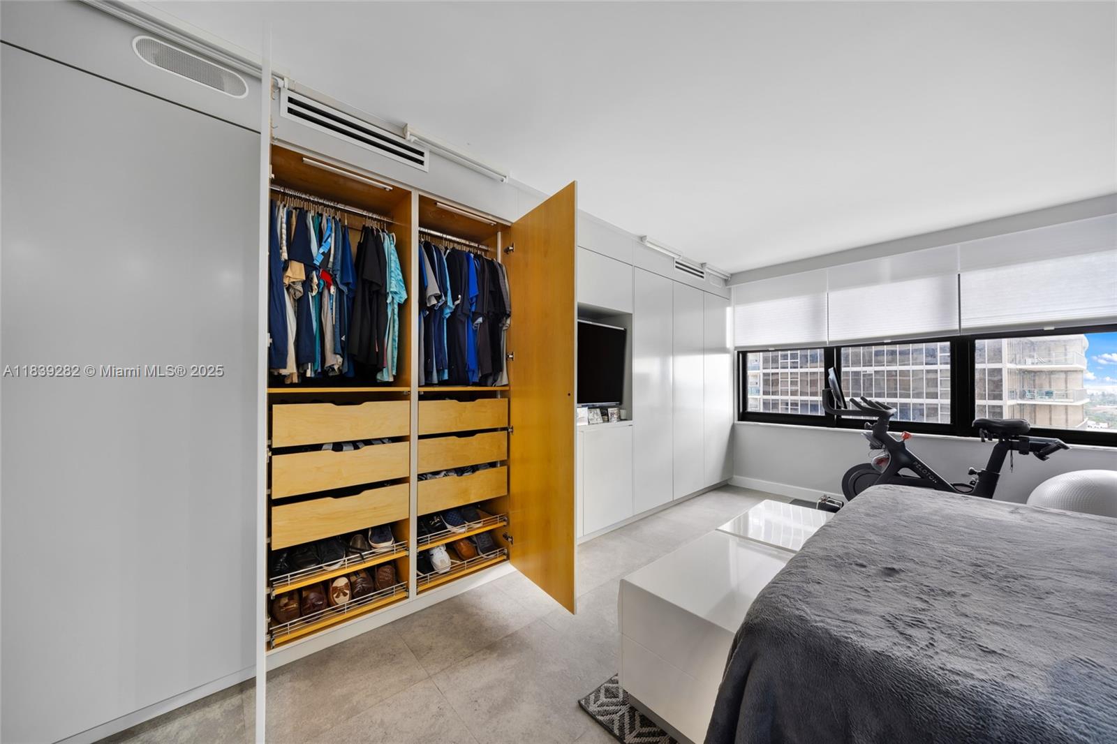 9801 Collins Avenue, Unit 16U Bal Harbour, FL 33154 - Photo 25 of 33 a bedroom with a bed and a window