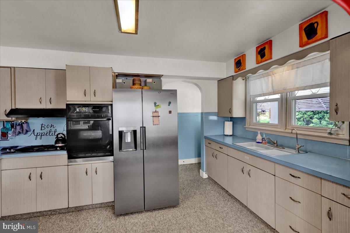 1308 Butter Lane Reading, PA 19606 - Photo 8 of 30 a kitchen with stainless steel appliances granite countertop a refrigerator and a sink
