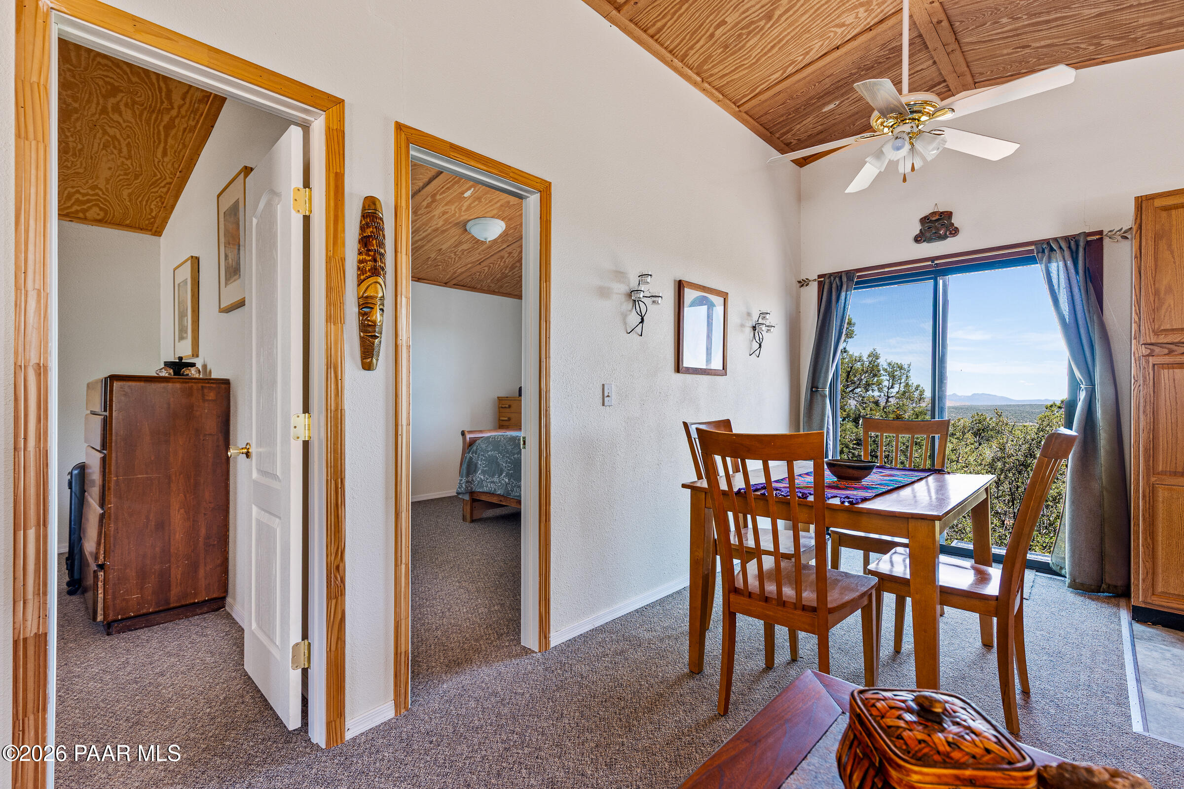 33749 West Whiskey River Road, Unit 21 Seligman, AZ 86337 - Photo 15 of 41 a view of a dining room with furniture window and wooden floor