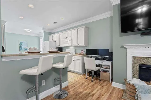 a kitchen with white cabinets