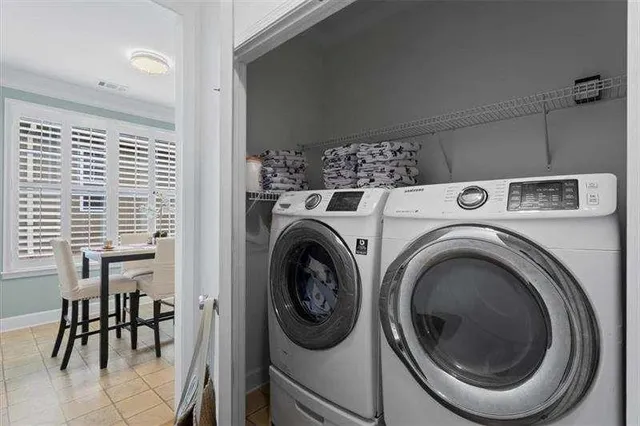 a bed sitting in a spacious bedroom next to a window