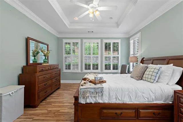 a bathroom with a granite countertop double vanity sink a mirror and a