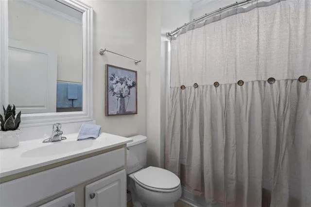 a view of a backyard with a small cabin and a chair