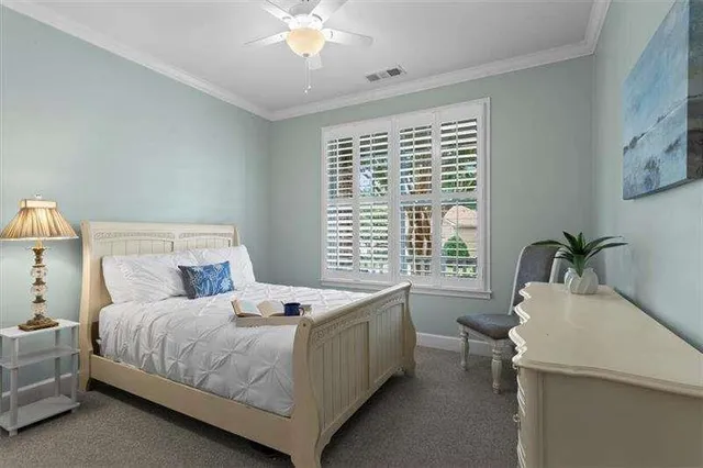 a view of a house with backyard sitting area and garden