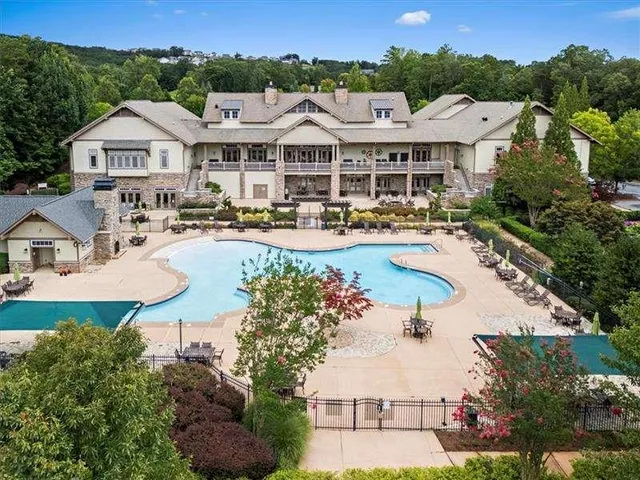 a view of a swimming pool with a yard