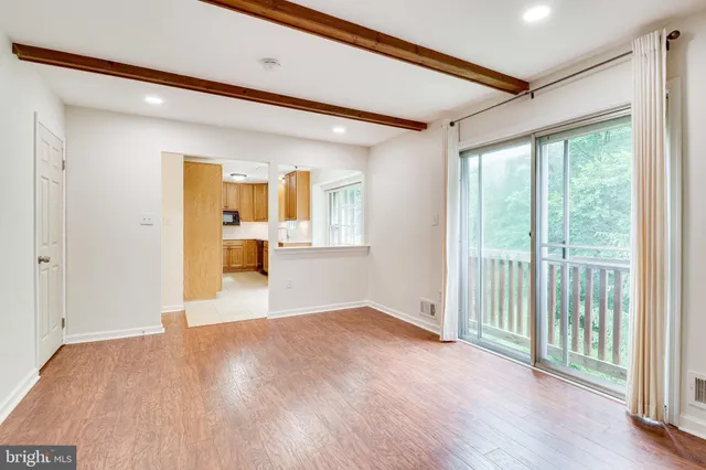a kitchen with stainless steel appliances a refrigerator and a stove