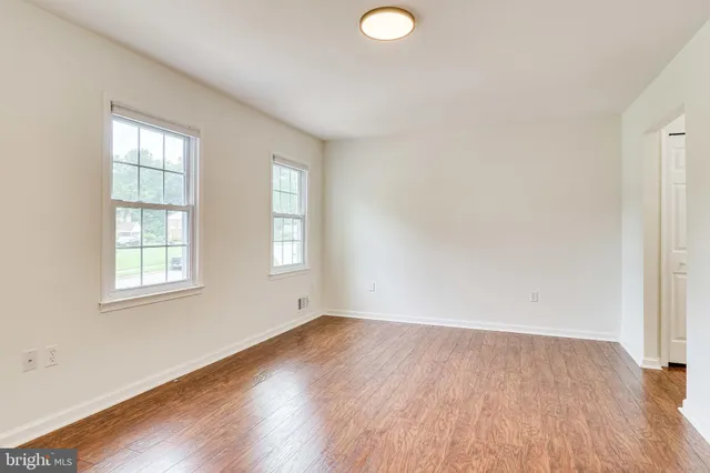 a backyard of a house with plants and trees