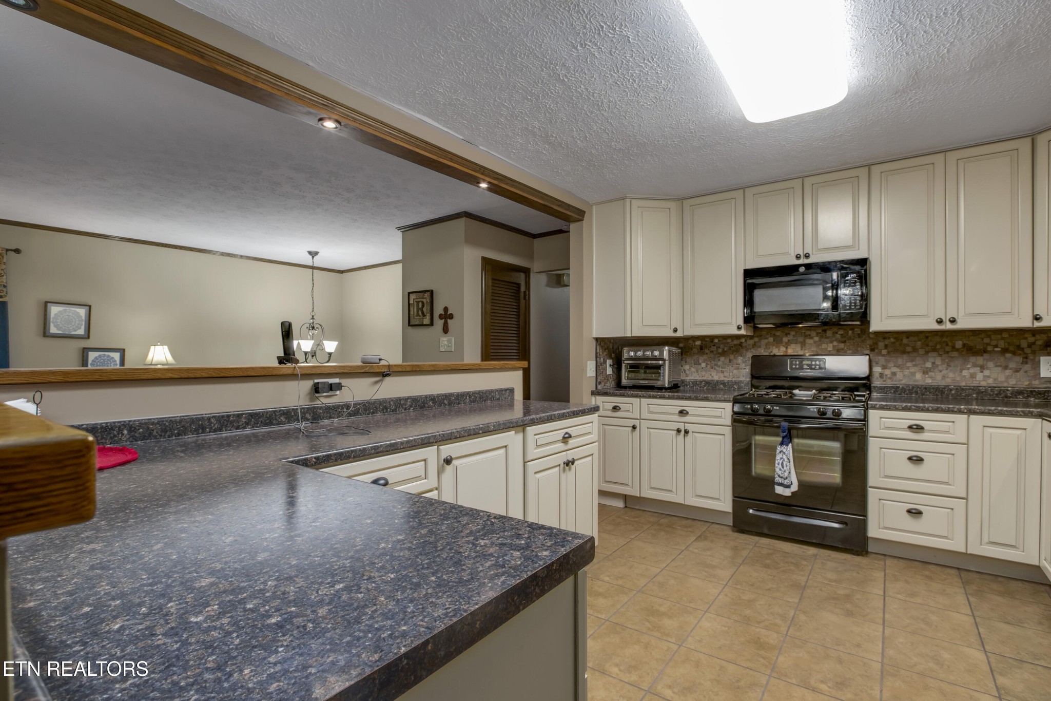 116 Mohawk Road Oak Ridge, TN 37830 - Photo 12 of 60 a kitchen with stainless steel appliances granite countertop a sink stove and cabinets