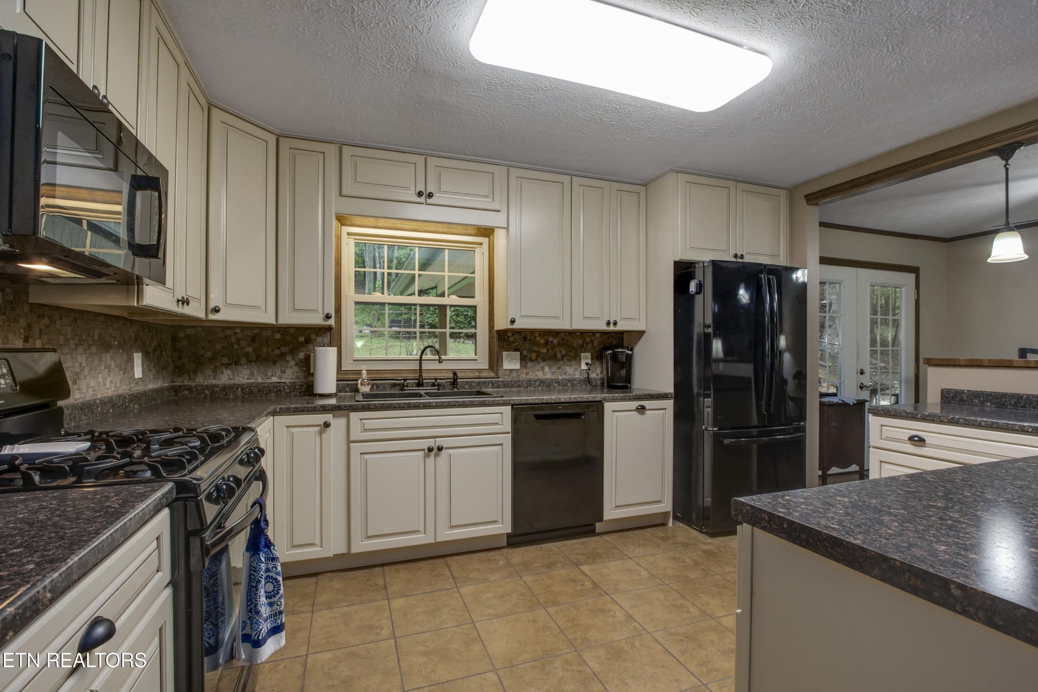 116 Mohawk Road Oak Ridge, TN 37830 - Photo 14 of 60 a kitchen with a refrigerator stove and sink