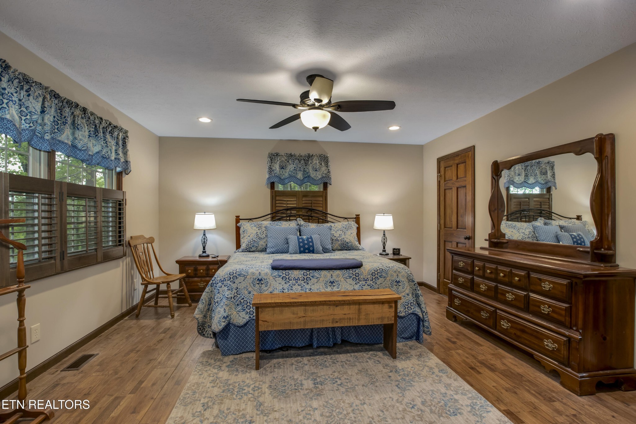 116 Mohawk Road Oak Ridge, TN 37830 - Photo 21 of 60 a spacious bedroom with a bed and a chandelier