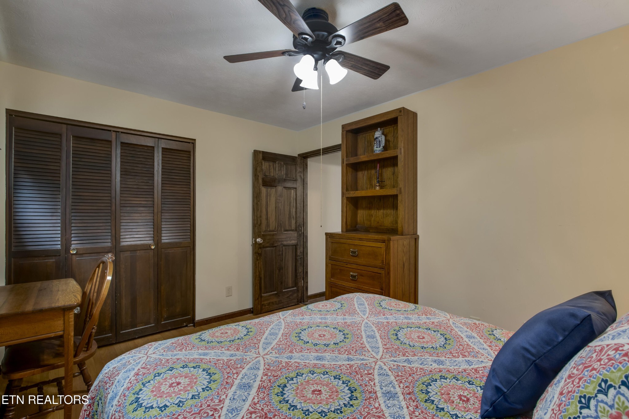 116 Mohawk Road Oak Ridge, TN 37830 - Photo 27 of 60 a bedroom with a bed and a chandelier