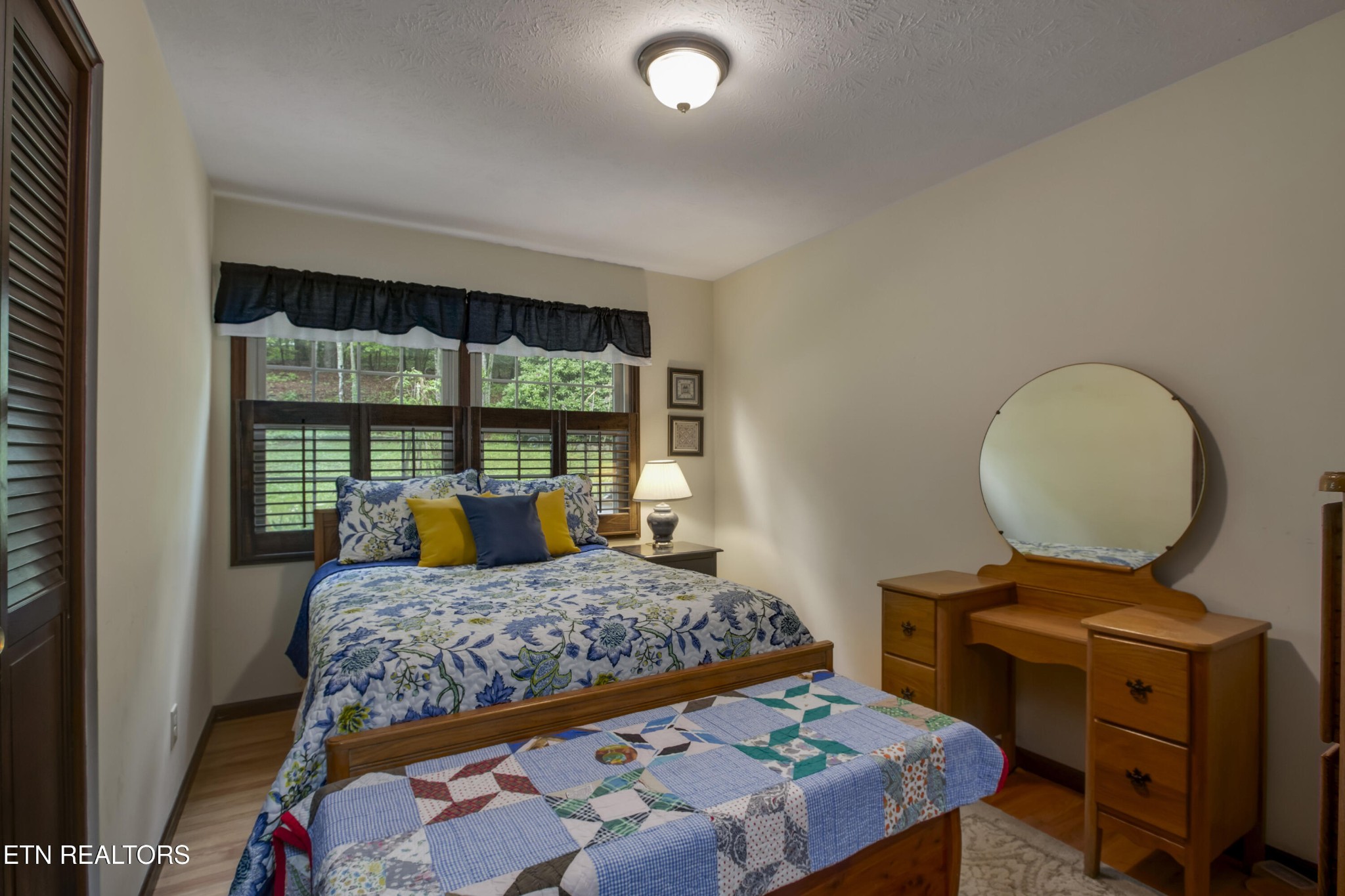 116 Mohawk Road Oak Ridge, TN 37830 - Photo 31 of 60 a bedroom with a bed and a large window