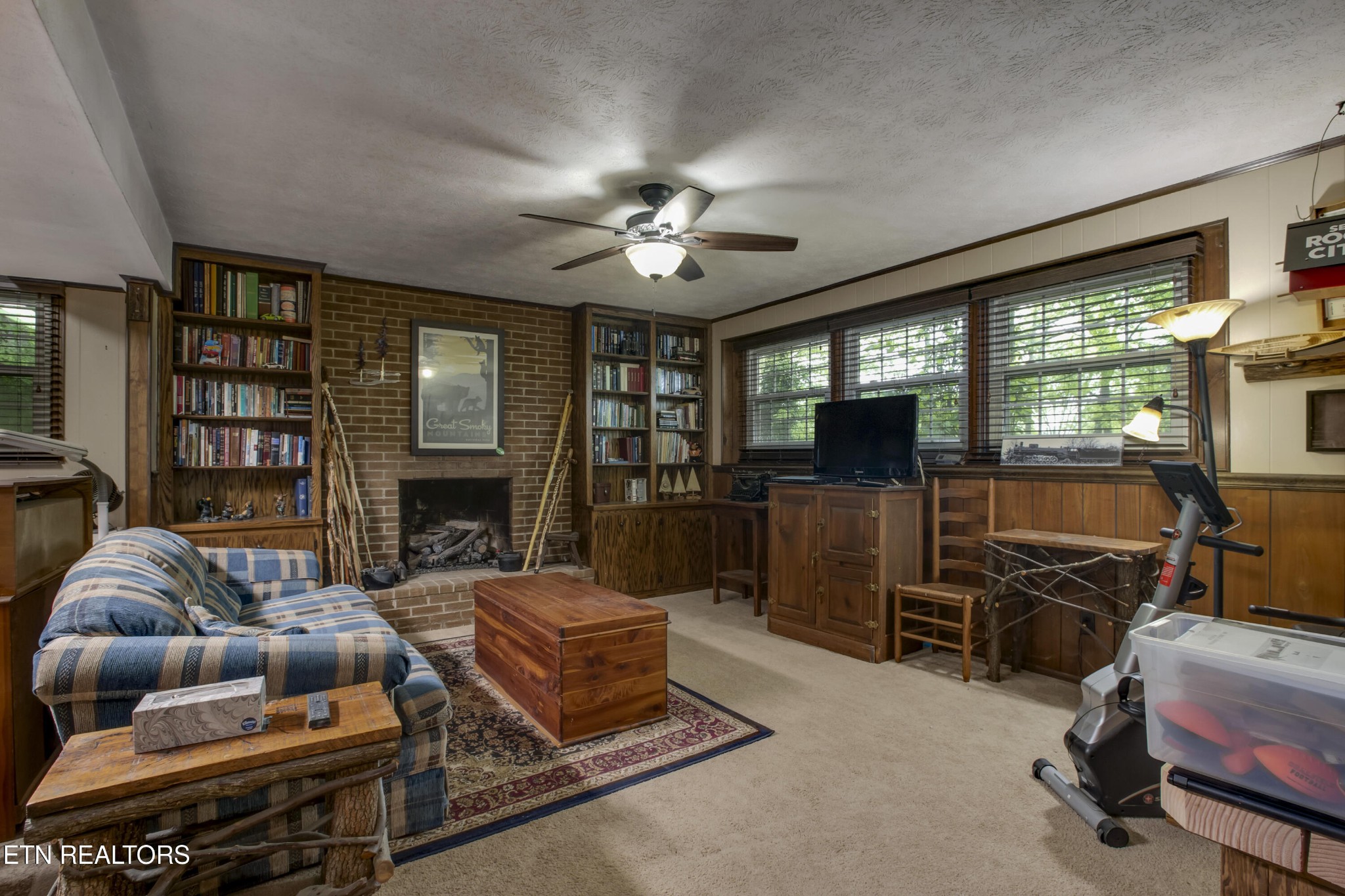 116 Mohawk Road Oak Ridge, TN 37830 - Photo 35 of 60 a living room with furniture a flat screen tv and a fireplace