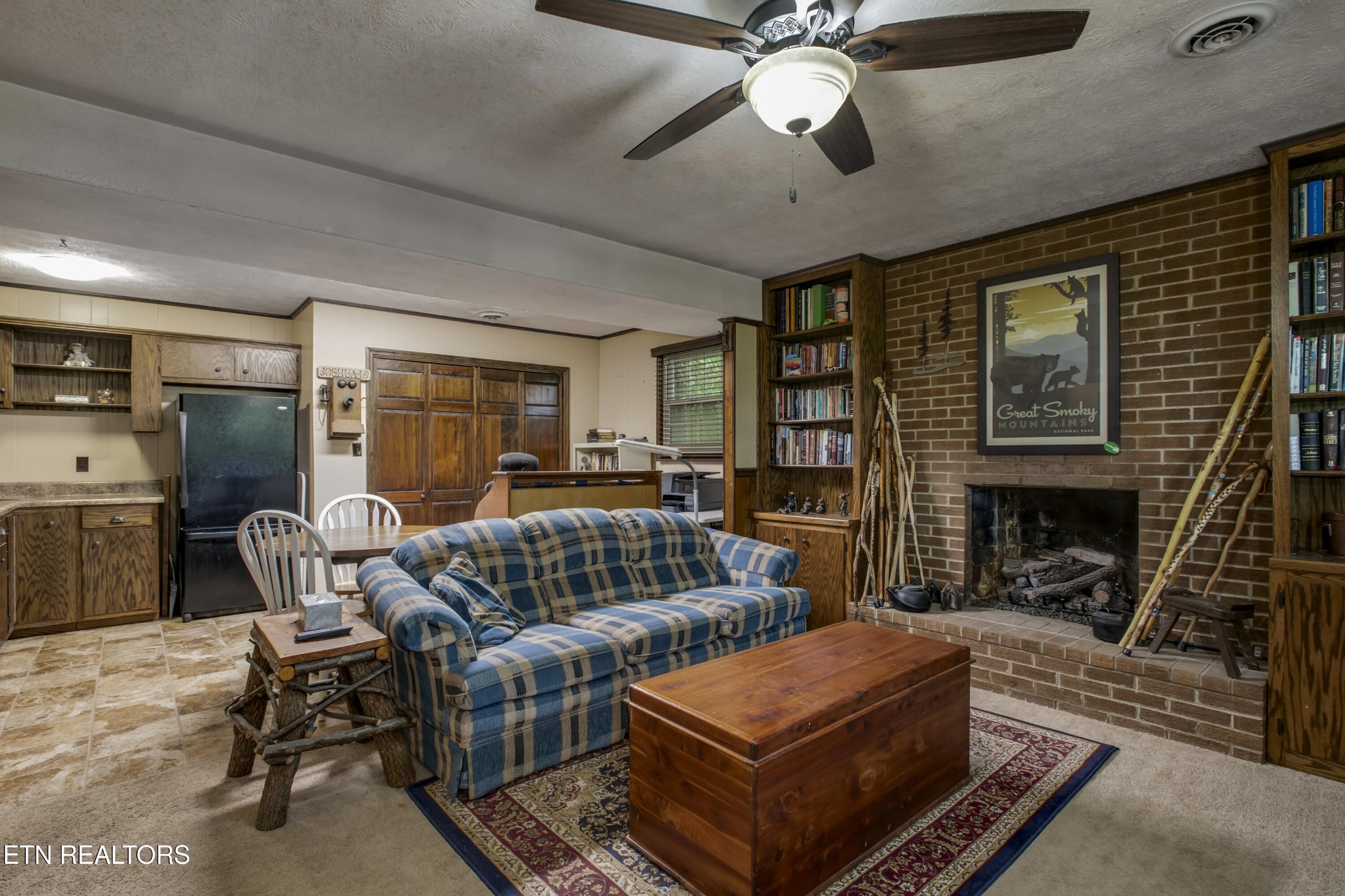 116 Mohawk Road Oak Ridge, TN 37830 - Photo 38 of 60 a living room with furniture a fireplace and a ceiling fan