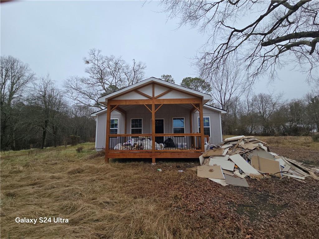 2292 Holly Springs Road Rockmart, GA 30153 - Photo 5 of 21 a view of a house with backyard and sitting area