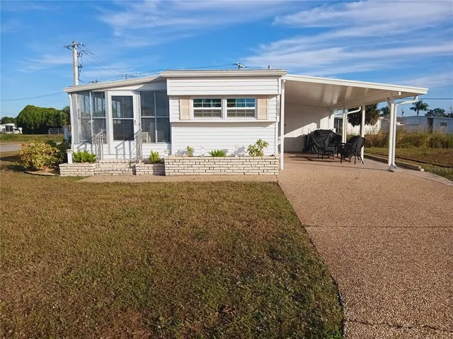 a front view of a house with yard outdoor seating and barbeque oven
