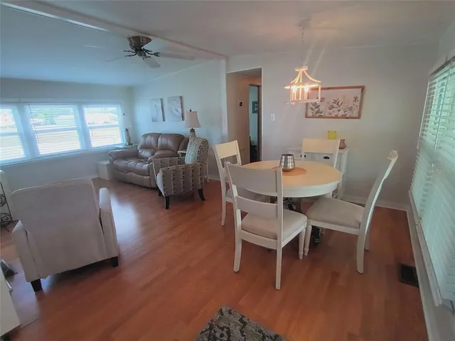 a bedroom with a bed and a dresser in it