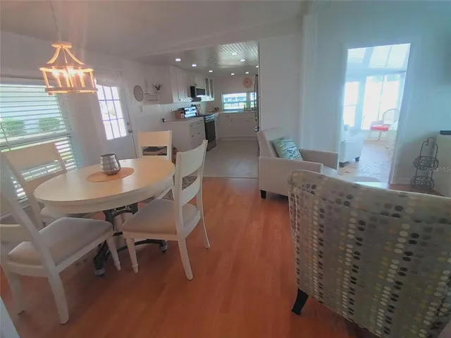a en suite bathroom with a granite countertop sink toilet and a mirror
