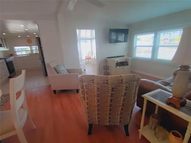 a white toilet sitting next to a shower