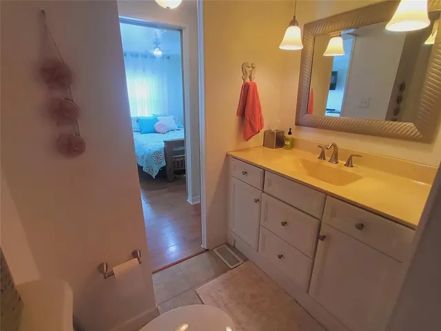 a bedroom with a bed and dresser