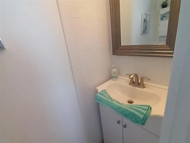 a living room with furniture and large windows