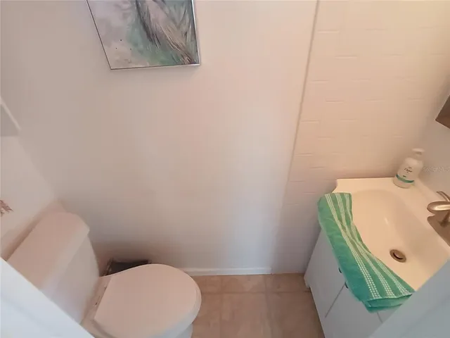 a living room with a couch and a rug