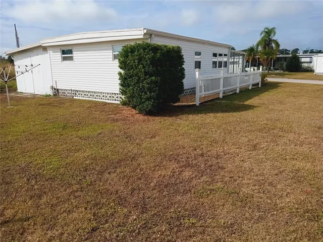 a workspace with furniture and a potted plant