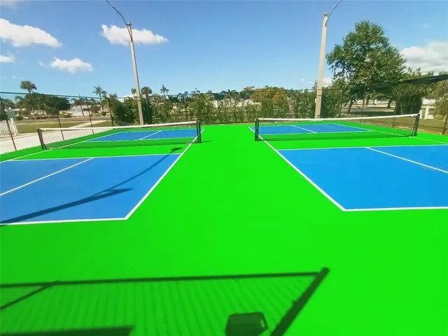 a view of a house with swimming pool and porch with sitting area