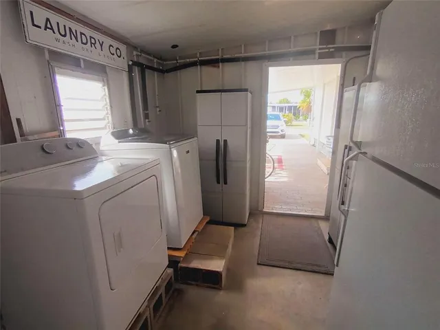 a view of a dining room with furniture and window