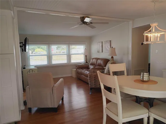 a kitchen with a sink cabinets and window