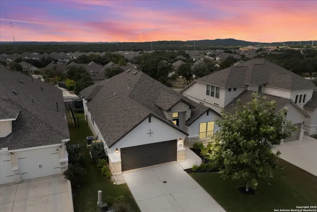 an aerial view of a house with a mountain view