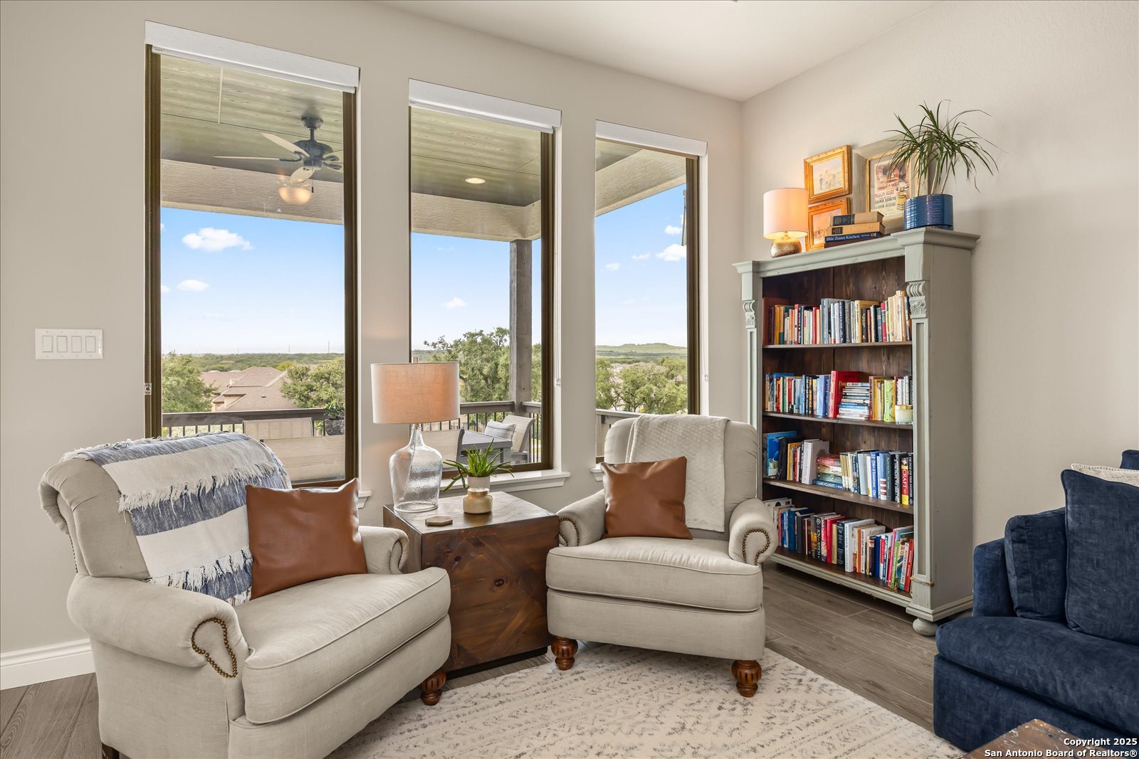 126 Ocotillo Boerne, TX 78006 - Photo 12 of 47 a living room with furniture and a book shelf