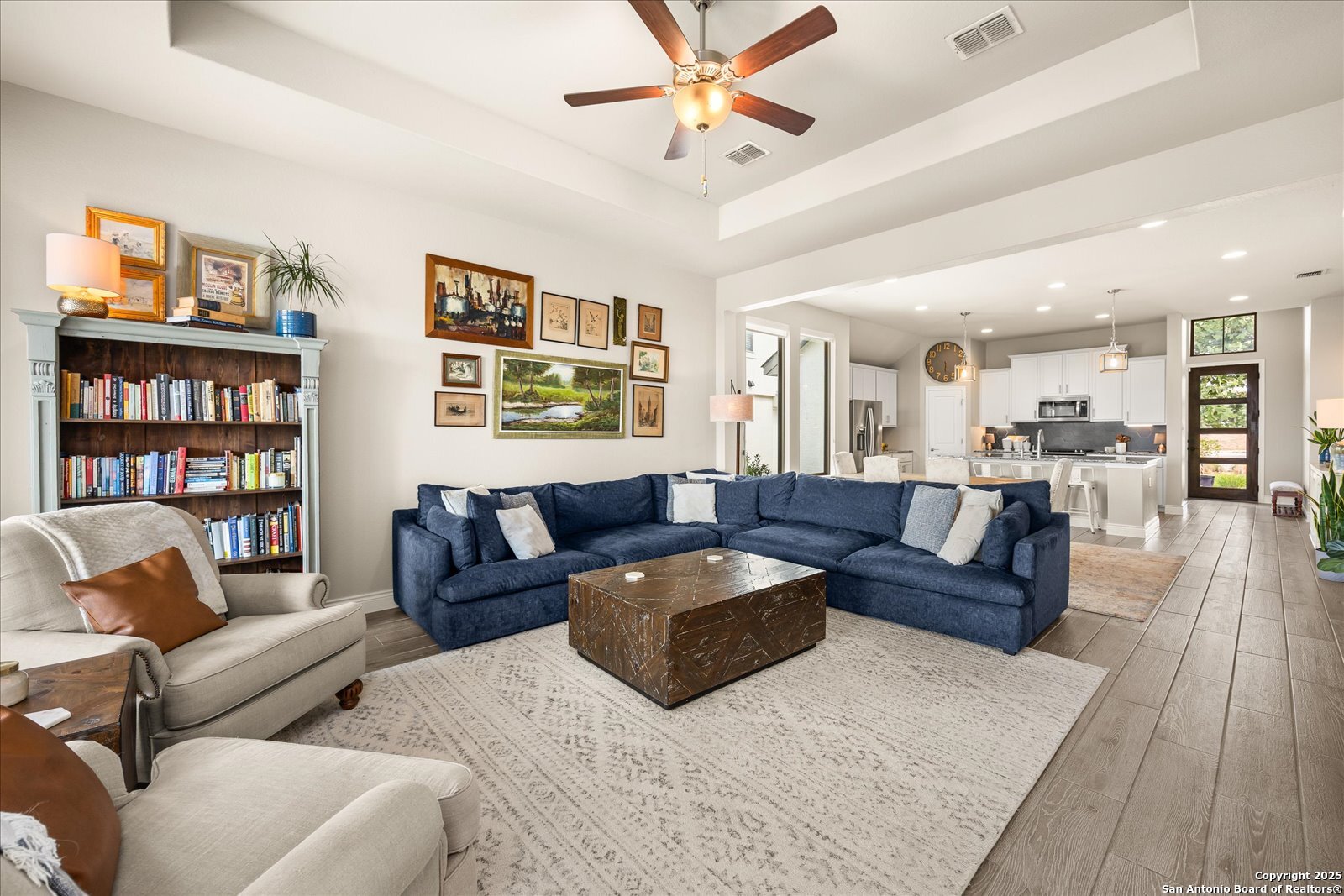 126 Ocotillo Boerne, TX 78006 - Photo 14 of 47 a living room with furniture and a book shelf