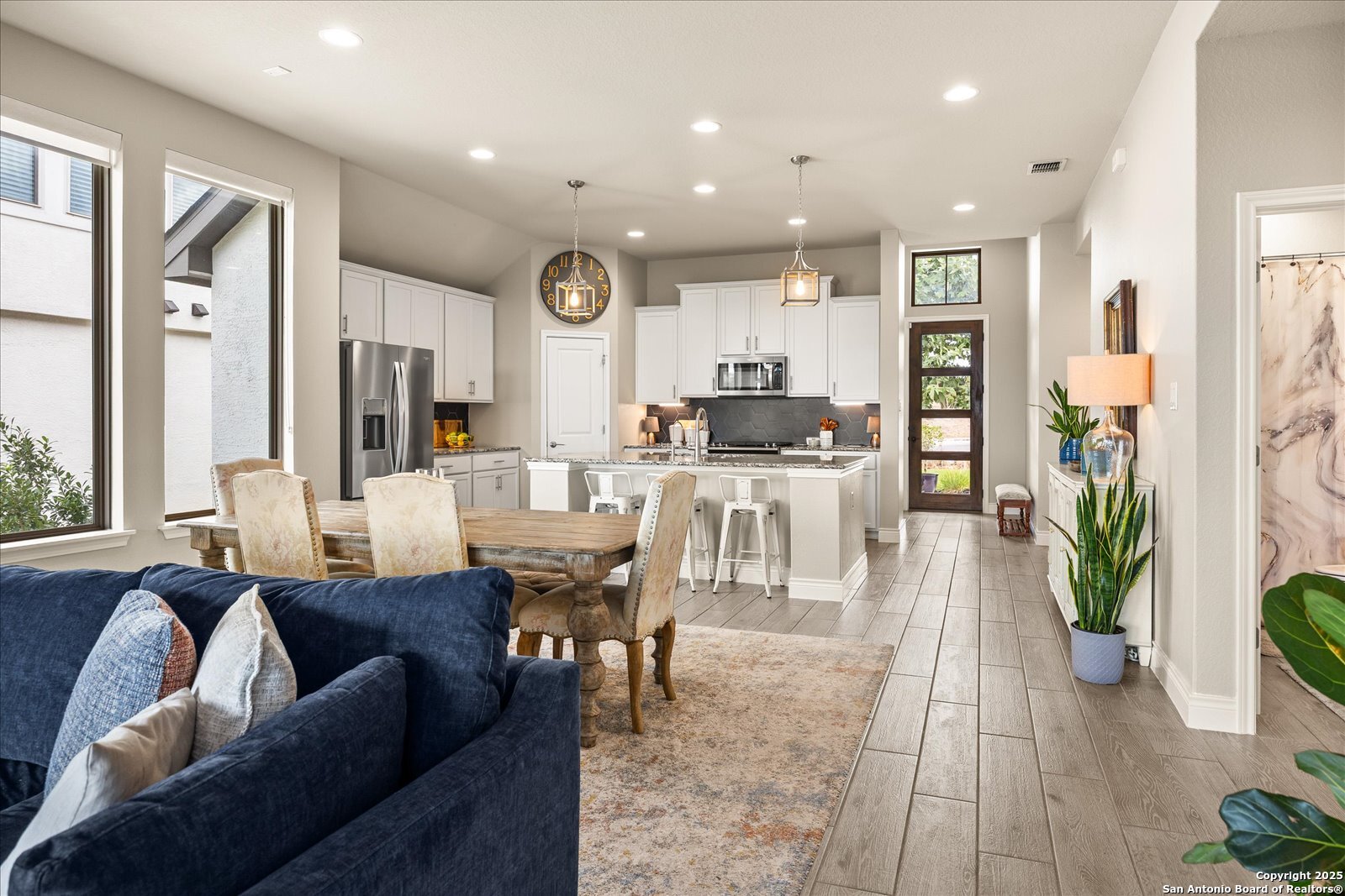 126 Ocotillo Boerne, TX 78006 - Photo 15 of 47 a living room with furniture kitchen view and a large window