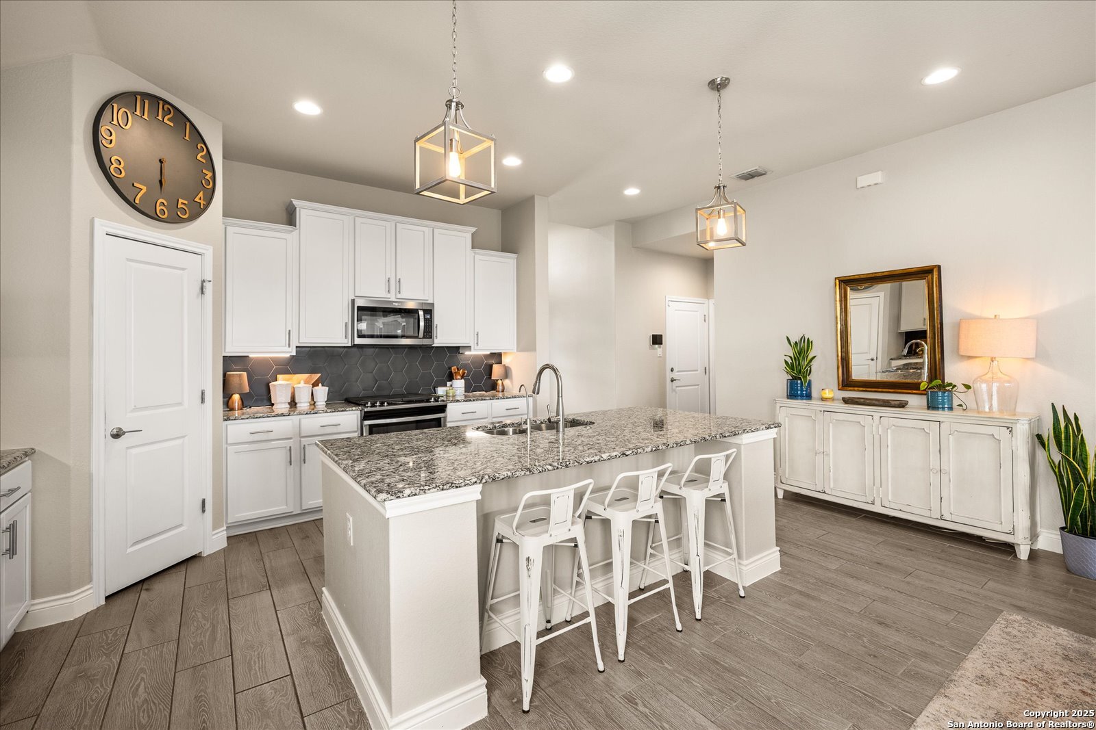 126 Ocotillo Boerne, TX 78006 - Photo 17 of 47 a kitchen with cabinets a sink a counter space and stainless steel appliances