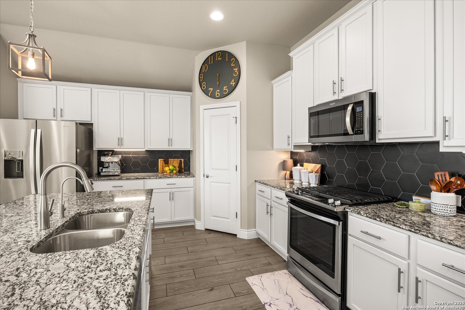 126 Ocotillo Boerne, TX 78006 - Photo 20 of 47 a kitchen with granite countertop a refrigerator stove top oven and sink