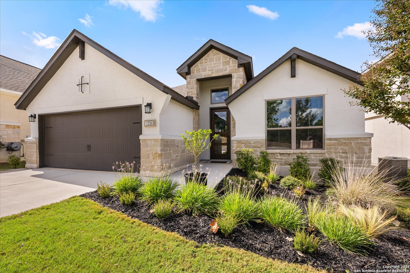 126 Ocotillo Boerne, TX 78006 - Photo 2 of 47 a front view of a house with garden