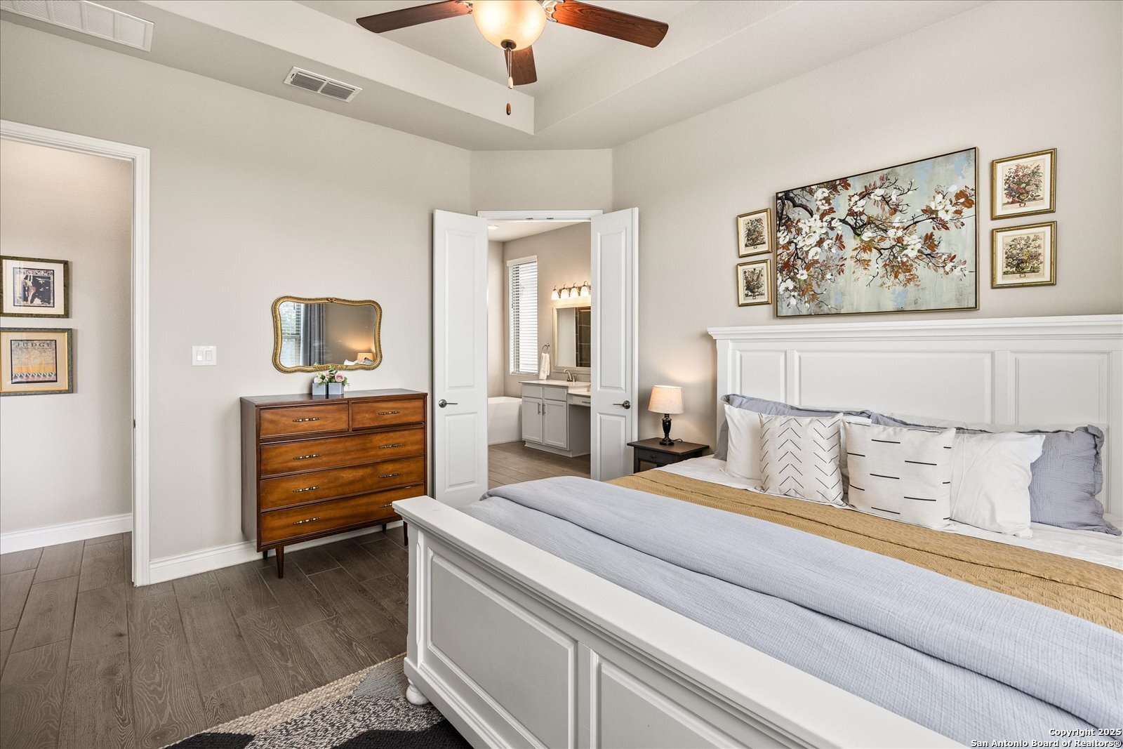 126 Ocotillo Boerne, TX 78006 - Photo 24 of 47 a bedroom with a bed and a chandelier