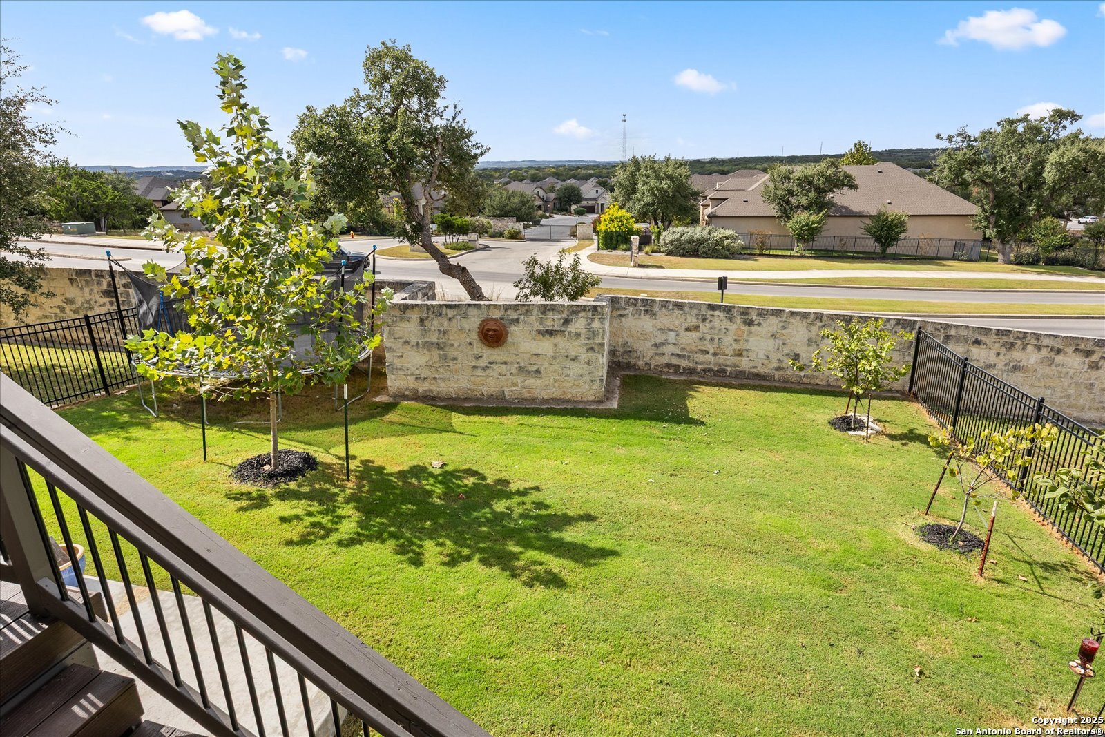 126 Ocotillo Boerne, TX 78006 - Photo 34 of 47 a view of a swimming pool with a garden and trees