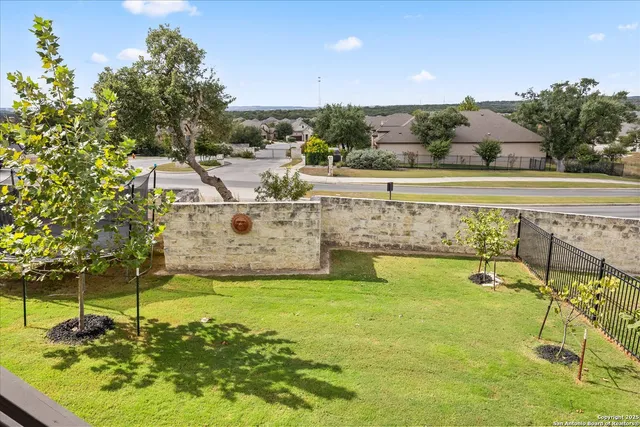a view of a swimming pool with a garden