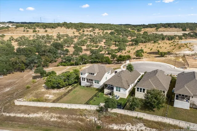 an aerial view of residential building with ocean view