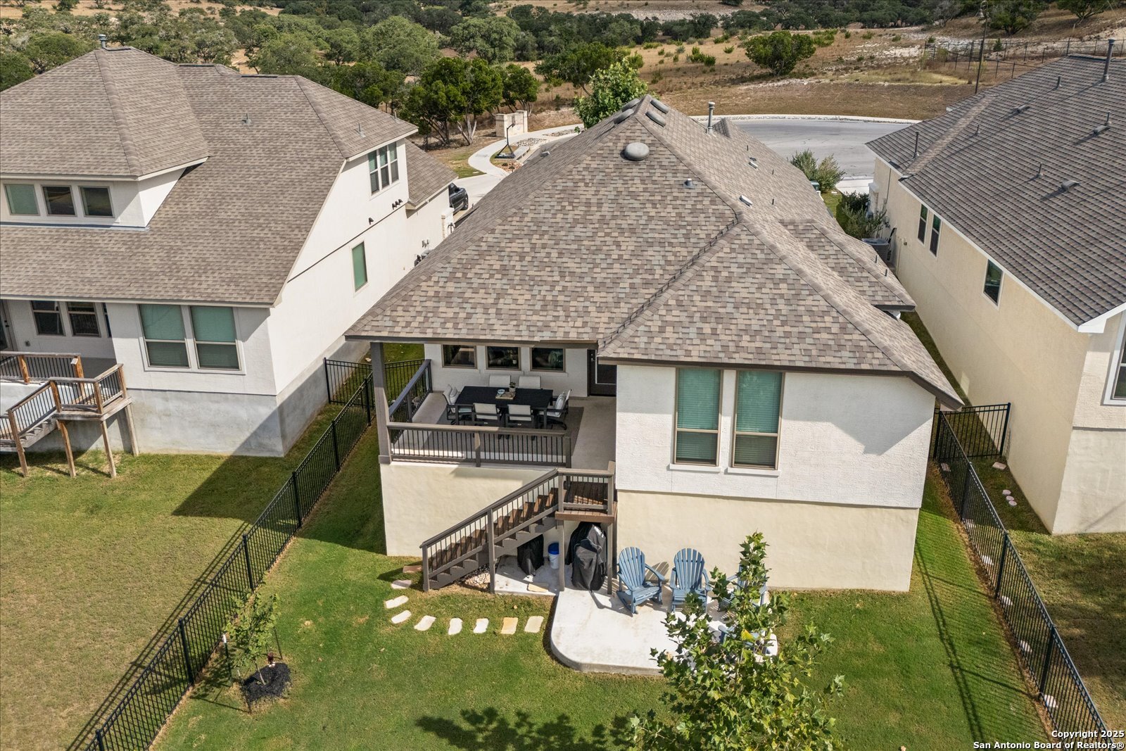 126 Ocotillo Boerne, TX 78006 - Photo 46 of 47 an aerial view of a house with swimming pool and large trees