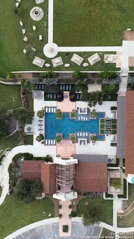 a front view of a multi story building with yard