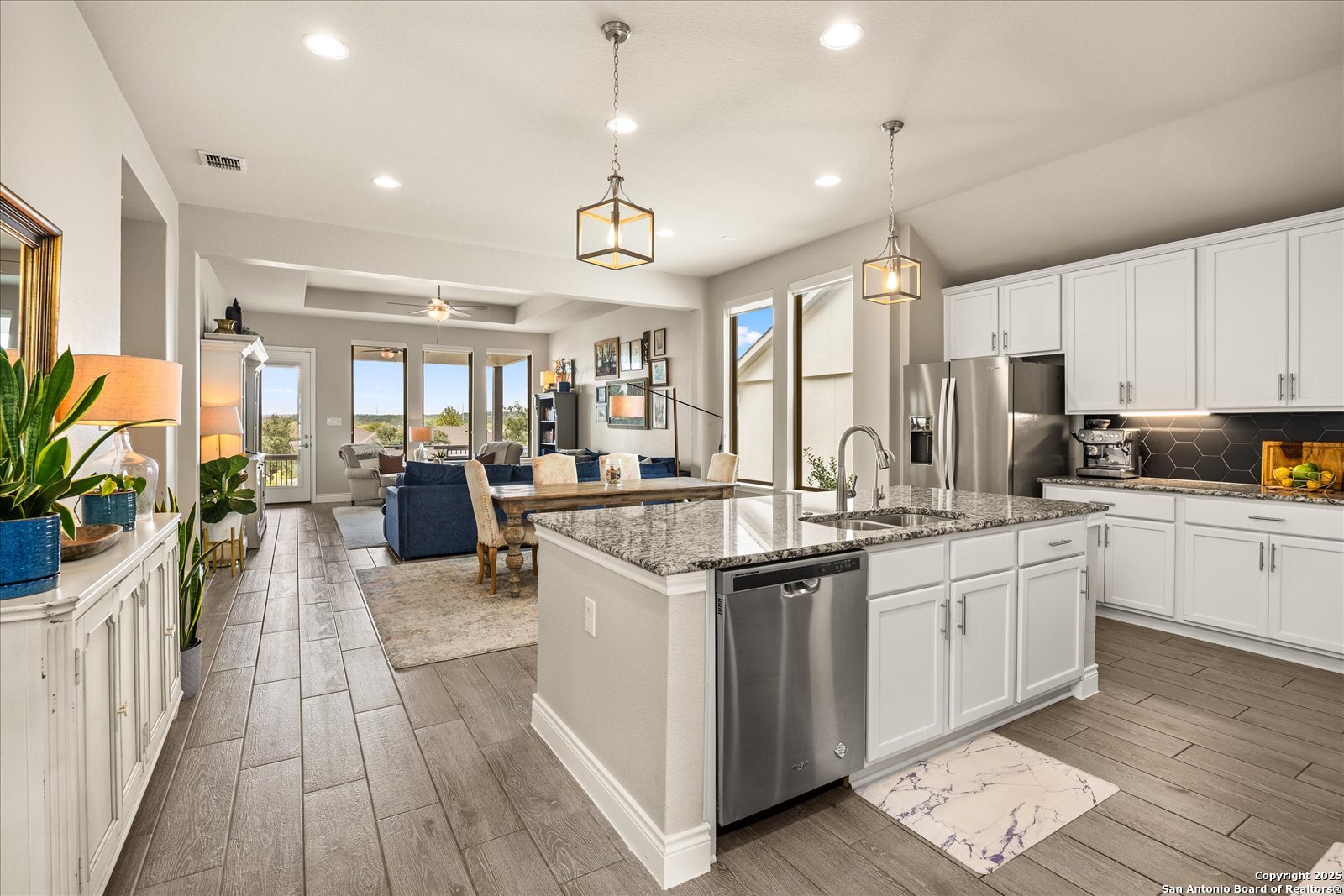 126 Ocotillo Boerne, TX 78006 - Photo 8 of 47 a kitchen with lots of counter top space a sink appliances and cabinets