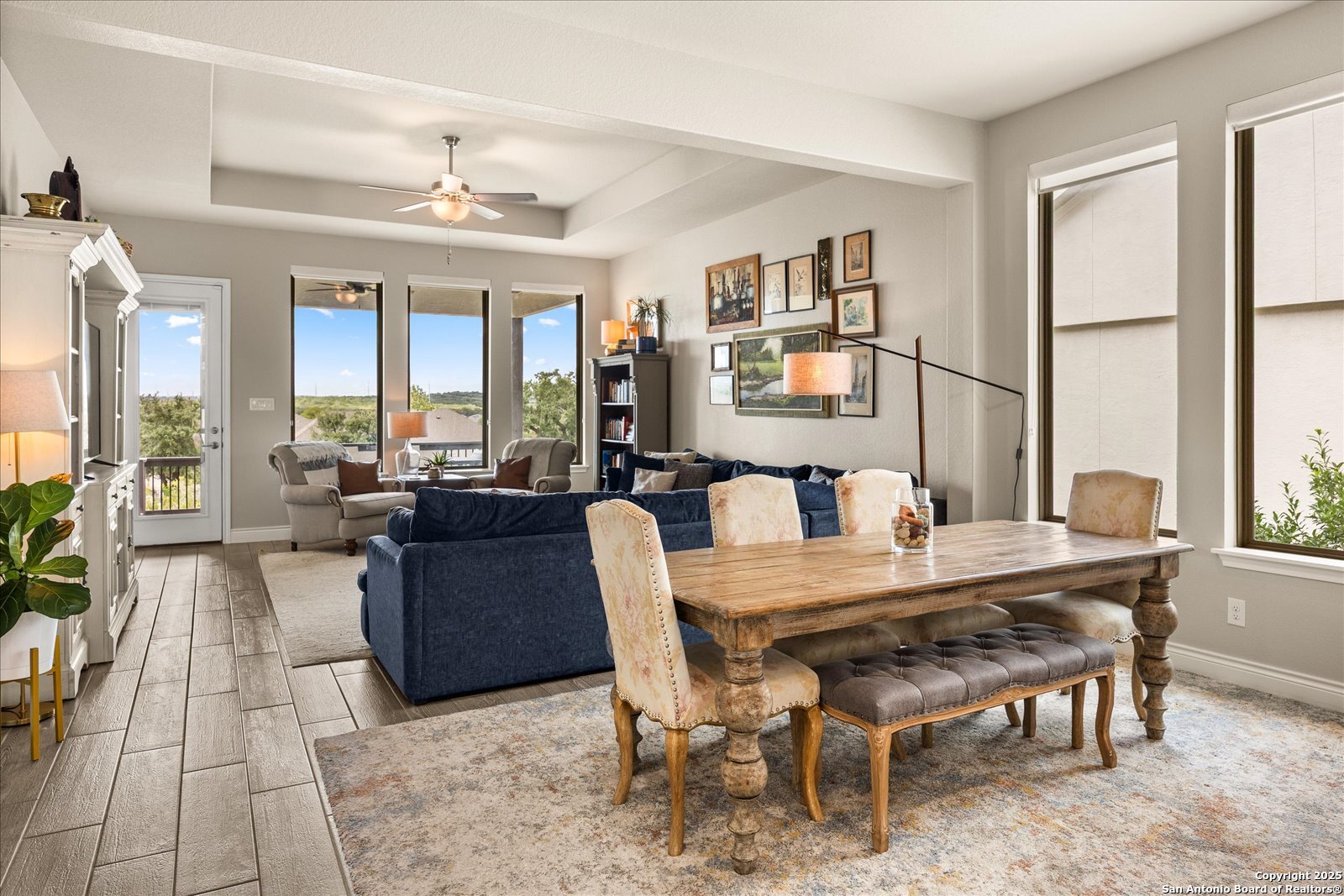 126 Ocotillo Boerne, TX 78006 - Photo 9 of 47 a view of a dining room with furniture large windows and wooden floor