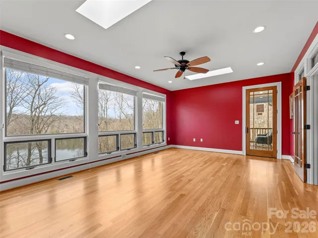 a view of livingroom with hardwood floor and a ceiling fan