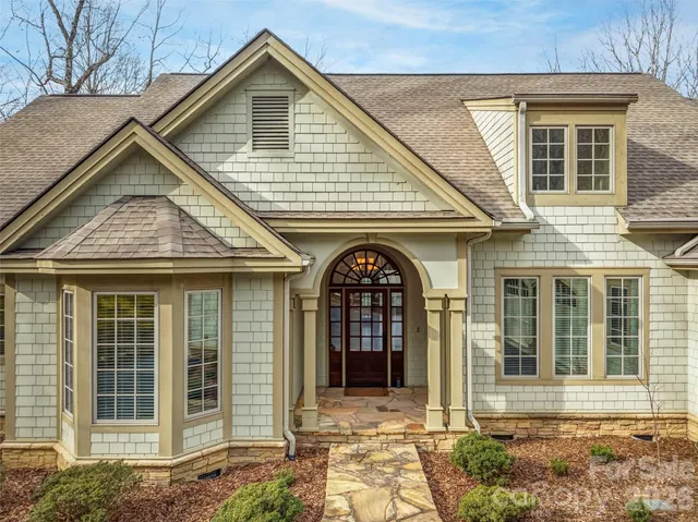 aerial view of a house with a yard