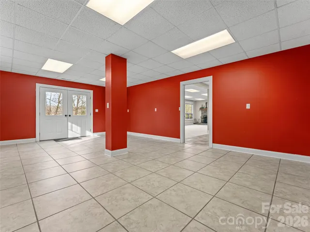 a view of an empty room and a window