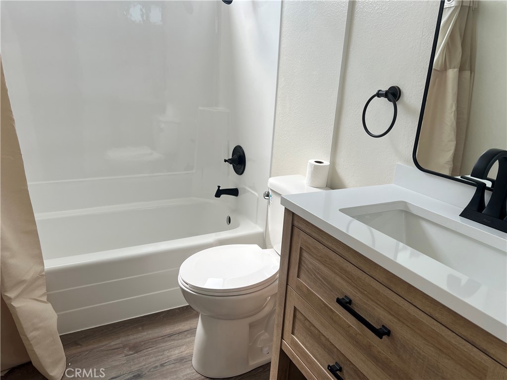 a bathroom with a sink a toilet and a bathtub