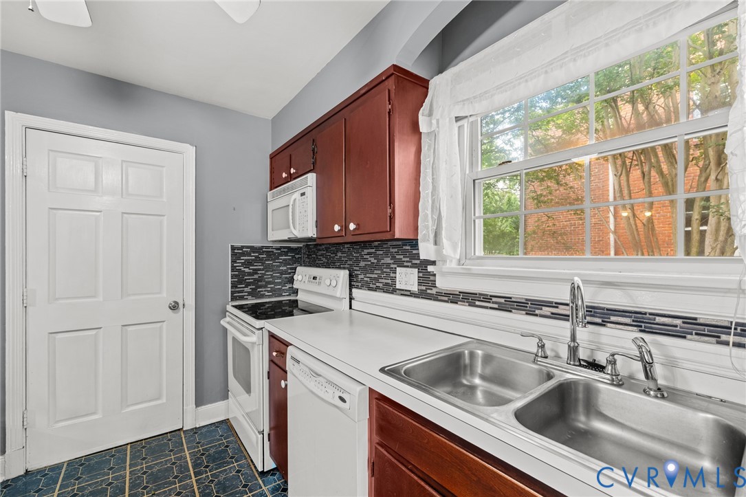 2405 Dumbarton Road Henrico, VA 23228 - Photo 20 of 34 Kitchen featuring wood cabinetry, white appliances